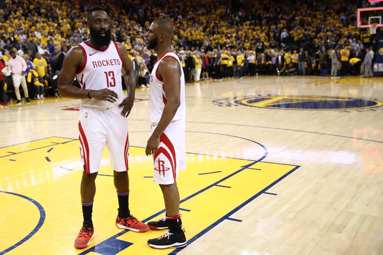 OAKLAND, CA - MAY 22: James Harden #13 and Chris Paul #3 of the Houston Rockets stand on the court as the officials review a play at the end of Game Four of the Western Conference Finals of the 2018 NBA Playoffs at ORACLE Arena on May 22, 2018 in Oakland, California. NOTE TO USER: User expressly acknowledges and agrees that, by downloading and or using this photograph, User is consenting to the terms and conditions of the Getty Images License Agreement. (Photo by Ezra Shaw/Getty Images)